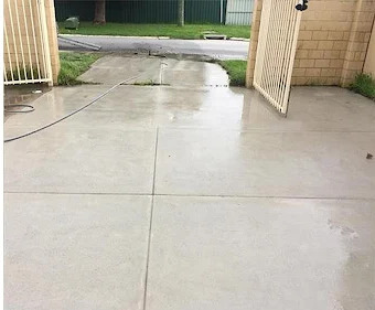 Clean restored driveway after pressure washing