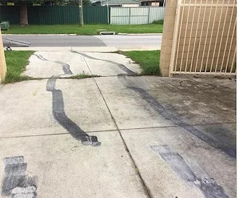 Dirty stained driveway in St. Catharines before cleaning